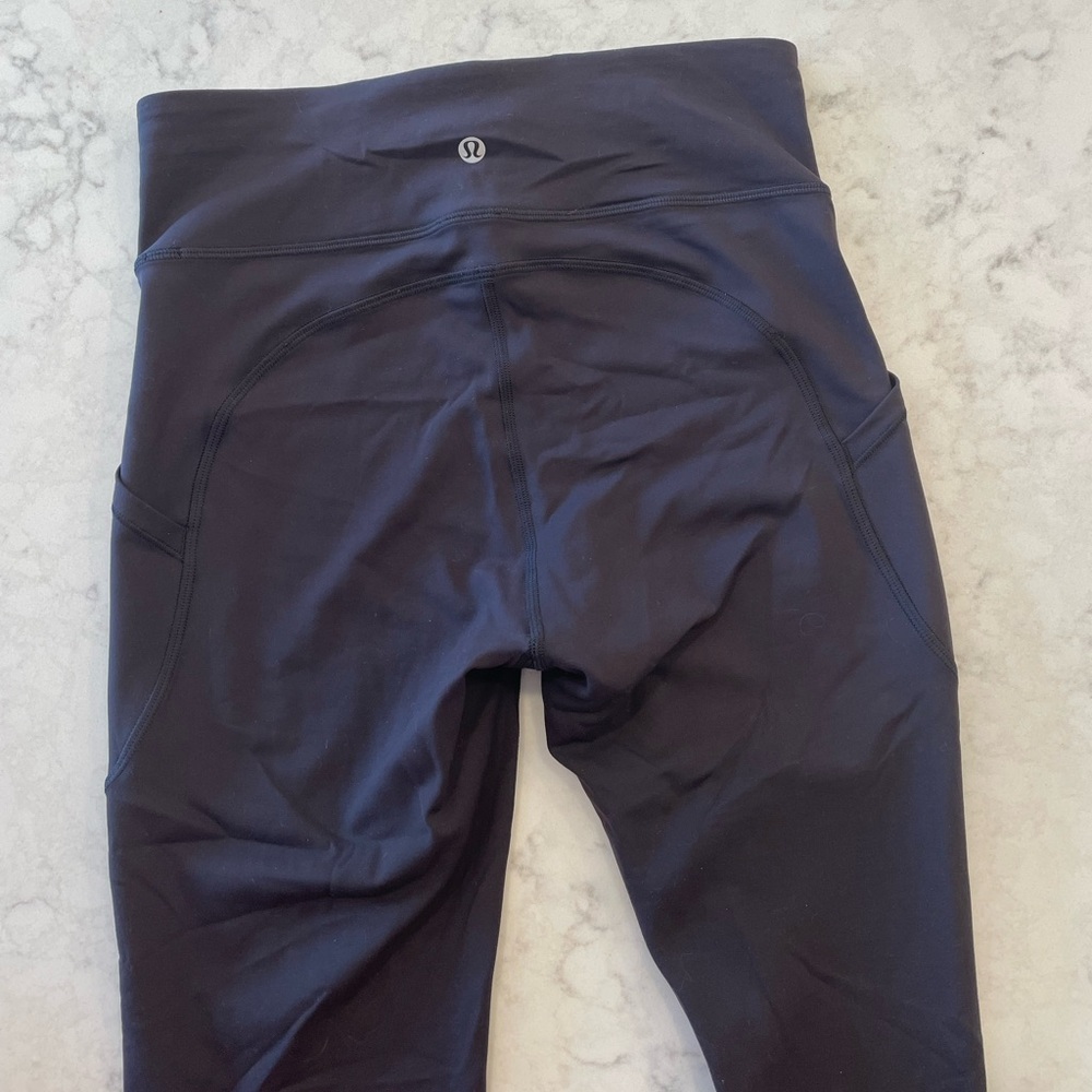 Lululemon leggings: black, cropped, Everlux fabric. Size 6.
